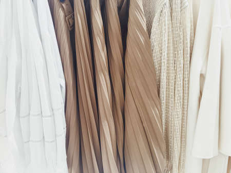 Clothing on display in a boutique store in shopping mall, fast fashion conceptの写真素材