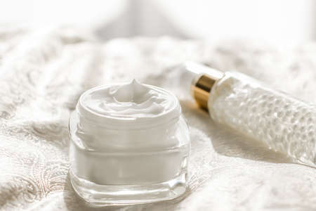 Face cream moisturizer in a jar and serum gel bottle, luxury skincare cosmetics and organic...
