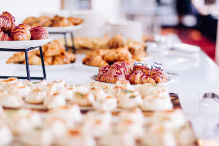 Pastry buffet served at charity event, sweet food and dessert table settingの写真素材