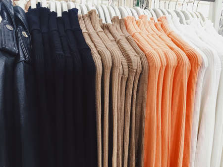 Clothing on display in a boutique store in shopping mall, fast fashion concept