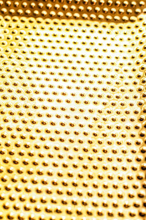 Texture of golden metallic surface as background, materials and interior design conceptの写真素材