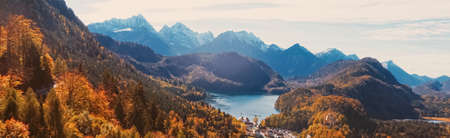 Beautiful nature of European Alps, landscape view of alpine mountains, lake and village in autumn season, travel and destination sceneryの写真素材