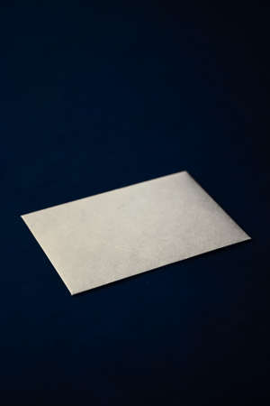Blank beige paper card on blue background, premium business and luxury brand identity mockupの写真素材