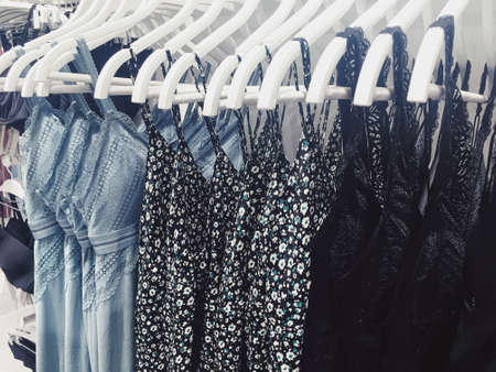 Clothing on display in a boutique store in shopping mall, fast fashion conceptの写真素材