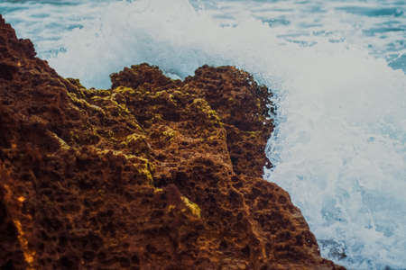 Storm in the ocean, sea waves crashing on rocks on the beach coast, nature and waterscape sceneryの写真素材