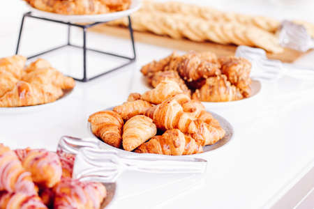 Pastry buffet served at charity event, sweet food and dessert table settingの写真素材