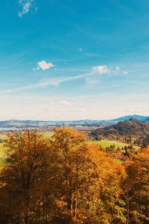Beautiful nature of European Alps, landscape view of alpine mountains, lake and village in autumn season, travel and destination sceneryの写真素材