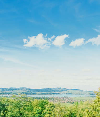 Beautiful nature of European Alps, landscape view of alpine mountains, lake and village in spring season, travel and destination sceneryの写真素材