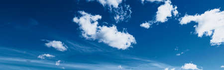 Bright blue sky with clouds, nature and environmental backgroundの写真素材
