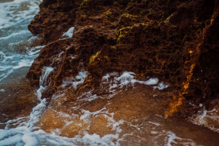 Storm in the ocean, sea waves crashing on rocks on the beach coast, nature and waterscape sceneryの写真素材