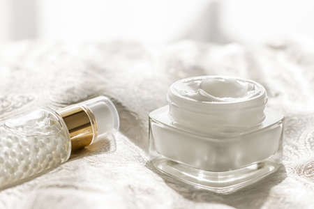 Face cream moisturizer in a jar and serum gel bottle, luxury skincare cosmetics and organic anti-aging product for health and beauty brandの写真素材