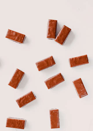 Milk chocolate candies isolated on white background, sweet food and tasty dessert