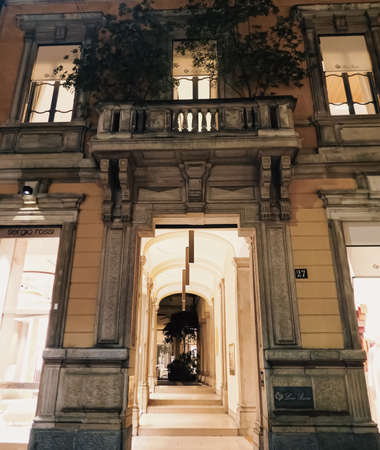 Milan, Italy circa January, 2020: Historical buildings, stores and boutique shops on Via Montenapoleone street in Milan at night, luxury shopping streetのeditorial素材
