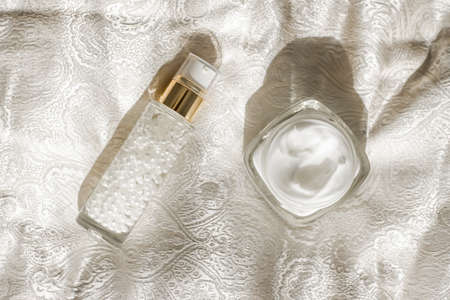 Face cream moisturizer in a jar and serum gel bottle, luxury skincare cosmetics and organic...