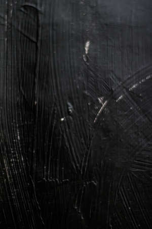 Dark gray background, charcoal paint texture as abstract backdrop, close-upの写真素材