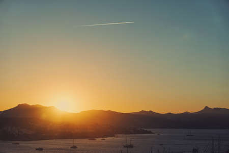 Beautiful sea view and mountains in the Mediterranean at sunset, summer vacation travel and holiday destinationの写真素材