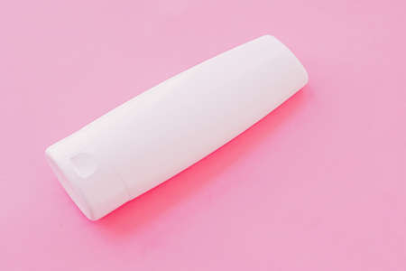 Moisturizing hand cream or body lotion on pink background, beauty product and skin care cosmetics,...