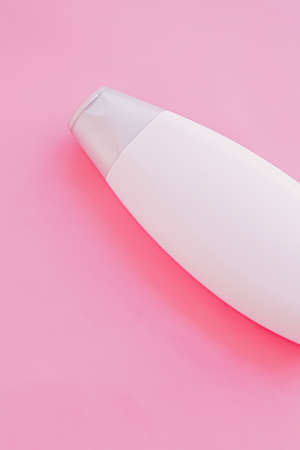 Blank label shampoo bottle or shower gel on pink background, beauty product and body care cosmetics, flatlayの写真素材
