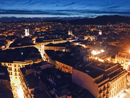 Malaga, Spain circa January, 2020: Streets of Malaga, the capital city of Andalucia region in Spain, Southern European architecture and historical buildings at nightのeditorial素材