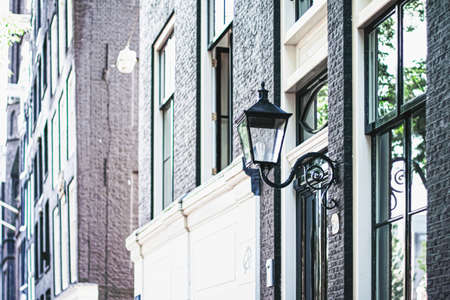 Architectural detail of a building on the main city center street of Amsterdam in Netherlands,...