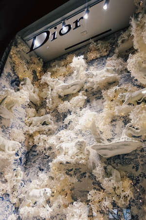 Milan, Italy circa January, 2020: Historical buildings, stores and boutique shops on Via...