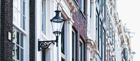 Architectural detail of a building on the main city center street of Amsterdam in Netherlands, european architectureの写真素材
