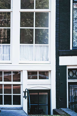 Architectural detail of a building on the main city center street of Amsterdam in Netherlands,...