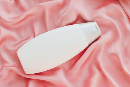 Blank label cosmetic container bottle as product mockup on pink silk background, hygiene and healthcareの写真素材