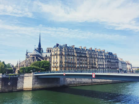 Paris, France circa April, 2019: Notre Dame cathedral and river Seine, famous landmark in Paris, Franceのeditorial素材