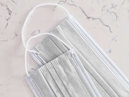 Surgical face masks for preventing infection during coronavirus pandemic, healthcare and hygieneの写真素材