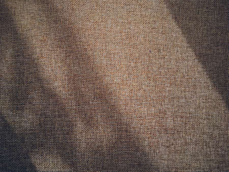 Linen texture and shadows as rustic background, fabric and materialの写真素材