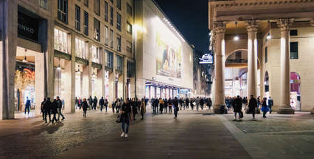 Milan, Italy circa January, 2020: Historical buildings on the city center streets of Milan in Lombardy region in Northern Italy at night, classic European architectureのeditorial素材