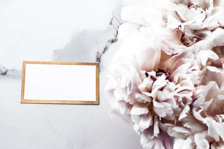 Glamorous business card or invitation mockup and bouquet of peony flowers, wedding and event branding designの写真素材
