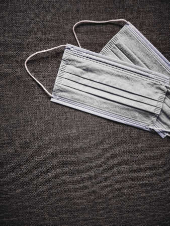 Surgical face masks for preventing infection during coronavirus pandemic, healthcare and hygieneの写真素材