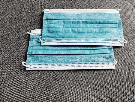 Surgical face masks for preventing infection during coronavirus pandemic, healthcare and hygieneの写真素材