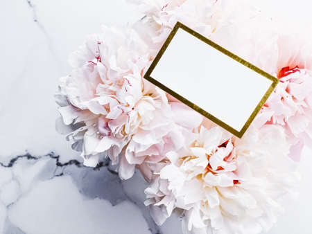 Glamorous business card or invitation mockup and bouquet of peony flowers, wedding and event branding designの写真素材