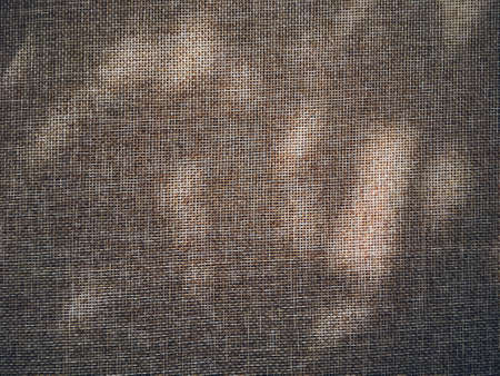 Linen texture and shadows as rustic background, fabric and materialの写真素材