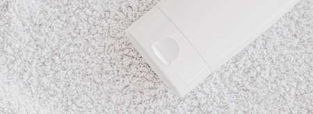 Blank label cosmetic container bottle as product mockup on white towel background, hygiene and healthcareの写真素材