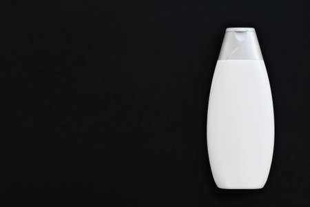 Blank label cosmetic container bottle as product mockup on black background, hygiene and healthcareの写真素材