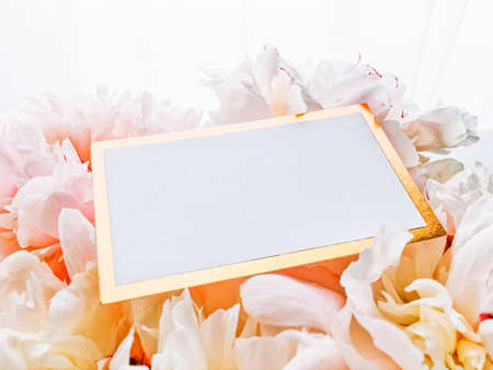 Glamorous business card or invitation mockup and bouquet of peony flowers, wedding and event...