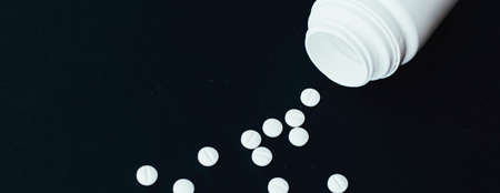 Pills and medical drugs, medicine and supplement for pharmaceutical industry and health care concept
