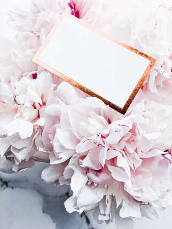 Glamorous business card or invitation mockup and bouquet of peony flowers, wedding and event branding designの写真素材