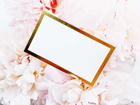 Glamorous business card or invitation mockup and bouquet of peony flowers, wedding and event branding designの写真素材