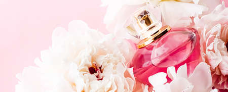 Luxurious fragrance bottle as chic perfume product on background of peony flowers, parfum ad and beauty branding designの写真素材