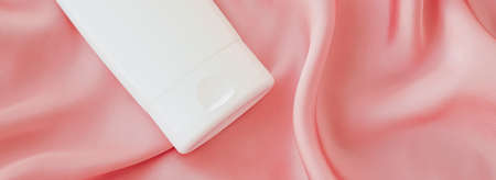 Blank label cosmetic container bottle as product mockup on pink silk background, hygiene and healthcareの写真素材