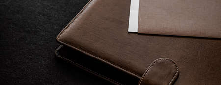 Office desk with briefcase and business card, finance and economy concept