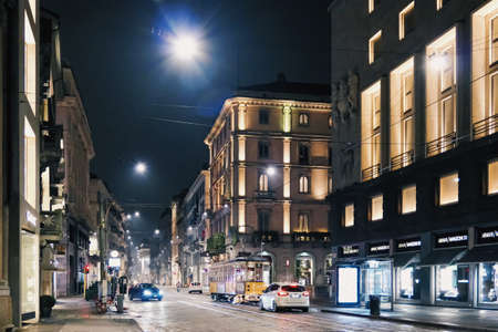 Milan, Italy circa January, 2020: Historical buildings on the city center streets of Milan in Lombardy region in Northern Italy at night, classic European architectureのeditorial素材