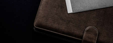 Office desk with briefcase and business card, finance and economy concept