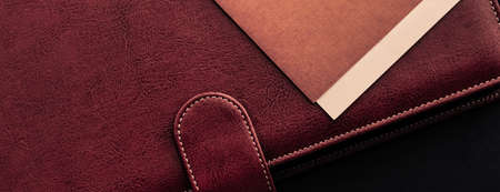 Office desk with briefcase and business card, finance and economy conceptの写真素材