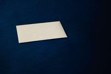 Blank beige paper card on blue background, premium business and luxury brand identity mockupの写真素材